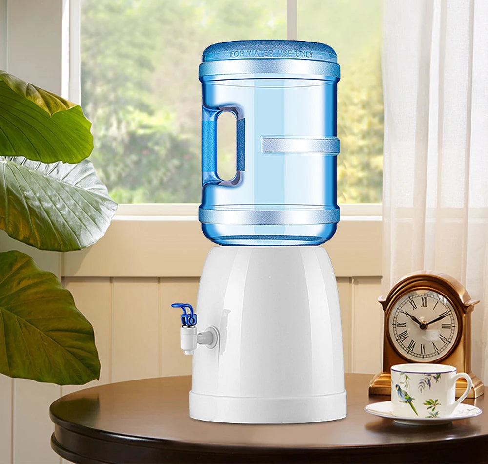 Aqua Zoom mini tabletop water dispenser for kids with a cup, portable manual water cooler, no electricity, ideal for kidsโ rooms.