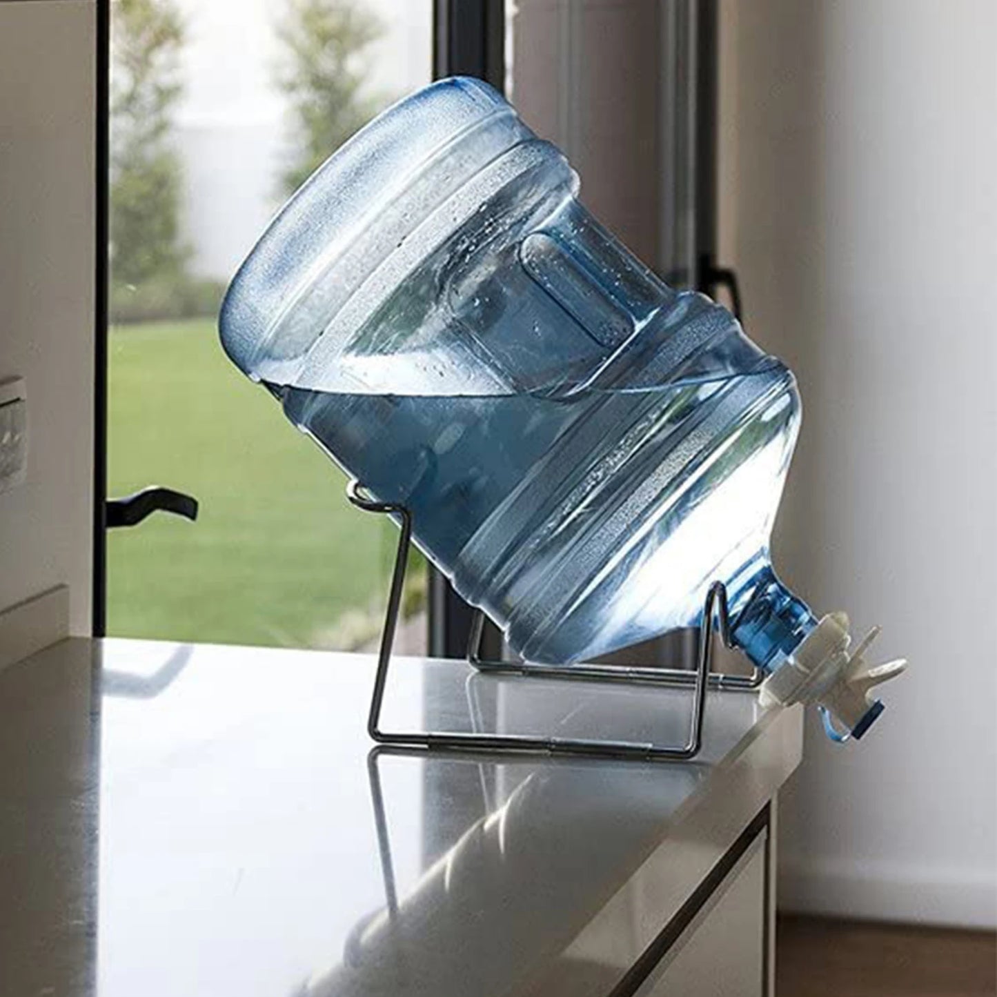 Aqua Zoom reusable water dispenser spigot tap attached to a large water bottle, showing leakproof drinking water flow.