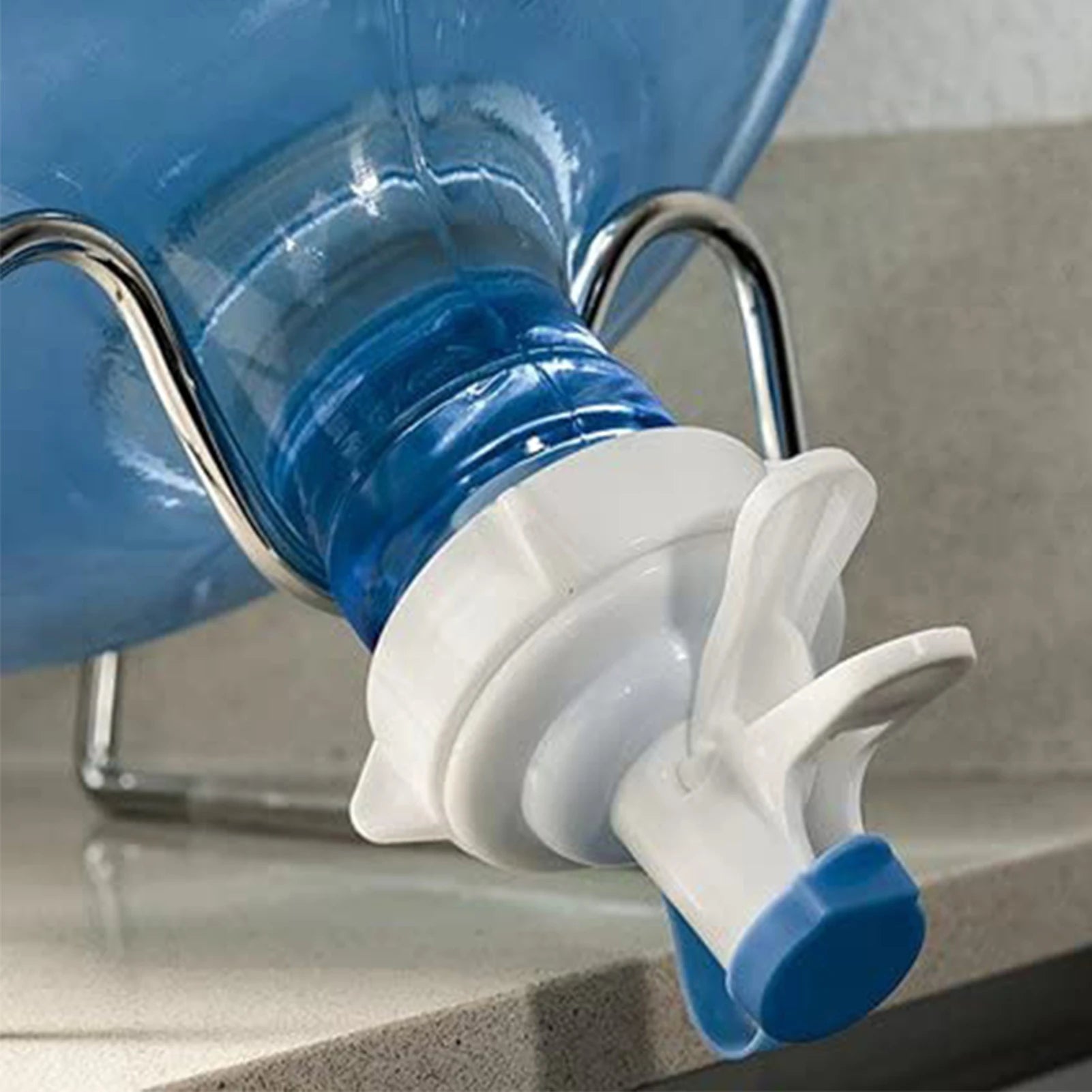 Aqua Zoom reusable water dispenser spigot faucet attached to a water bottle, showing leakproof drinking water tap for home, office, or school.