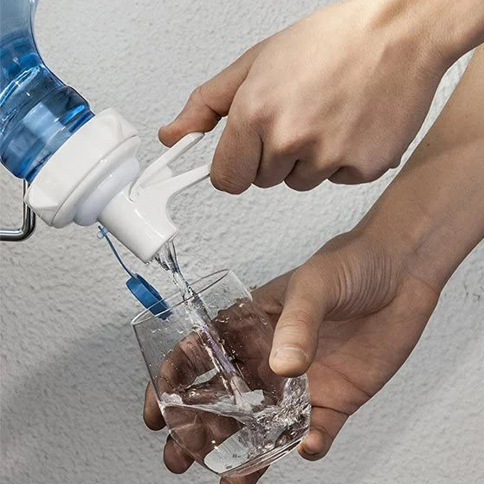 Aqua Zoom reusable water dispenser spigot tap attached to a water bottle, showing leakproof design and easy-drink spout for water bottles.